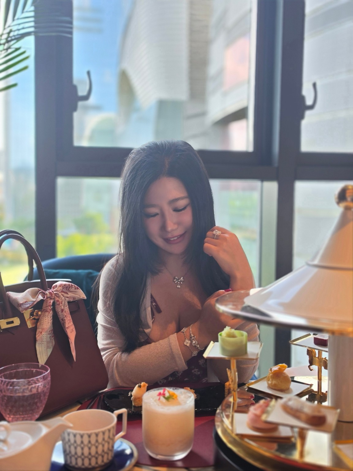 Tamara wearing fine jewelry at afternoon tea